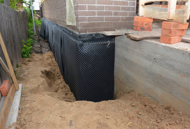 Happy homeowners after waterproofing job in Flanders